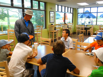 Glen Beaver addresses students to begin golf camp.