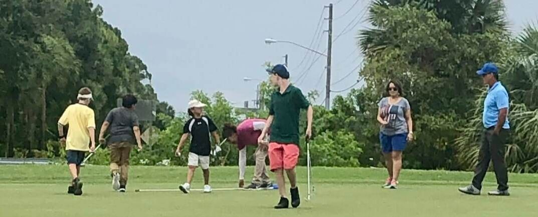 Coach Glen Beaver shows up while his students play golf at Okeeheelee.